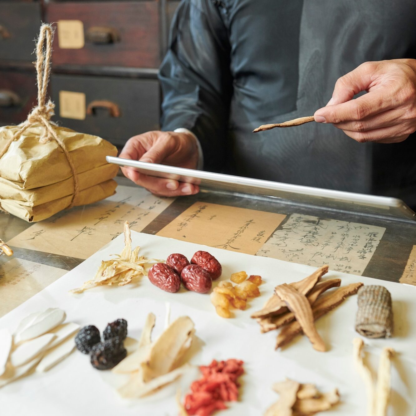 Chinese medicine practitioner selecting ingredients