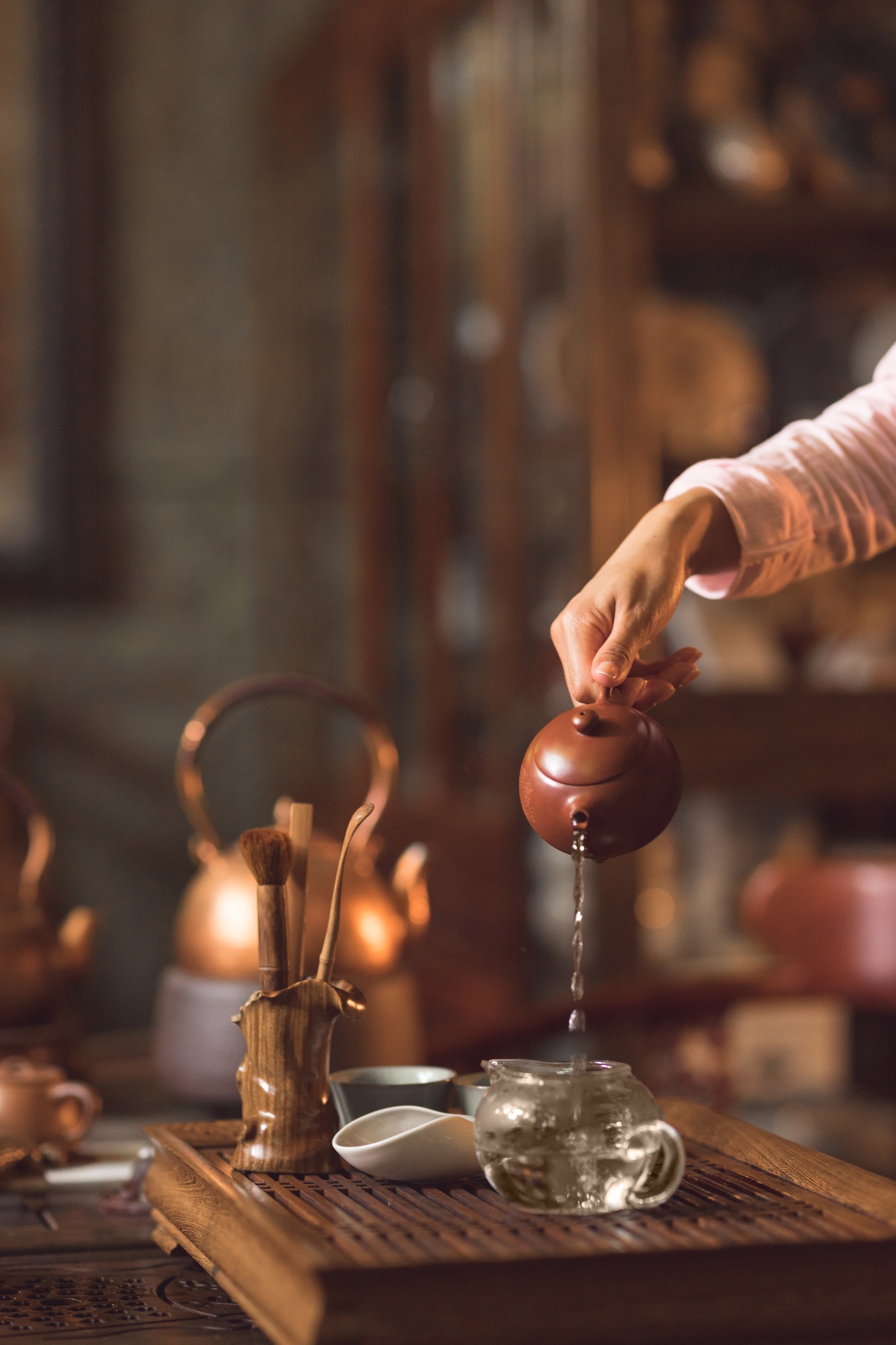 Master pouring tea from a teapot